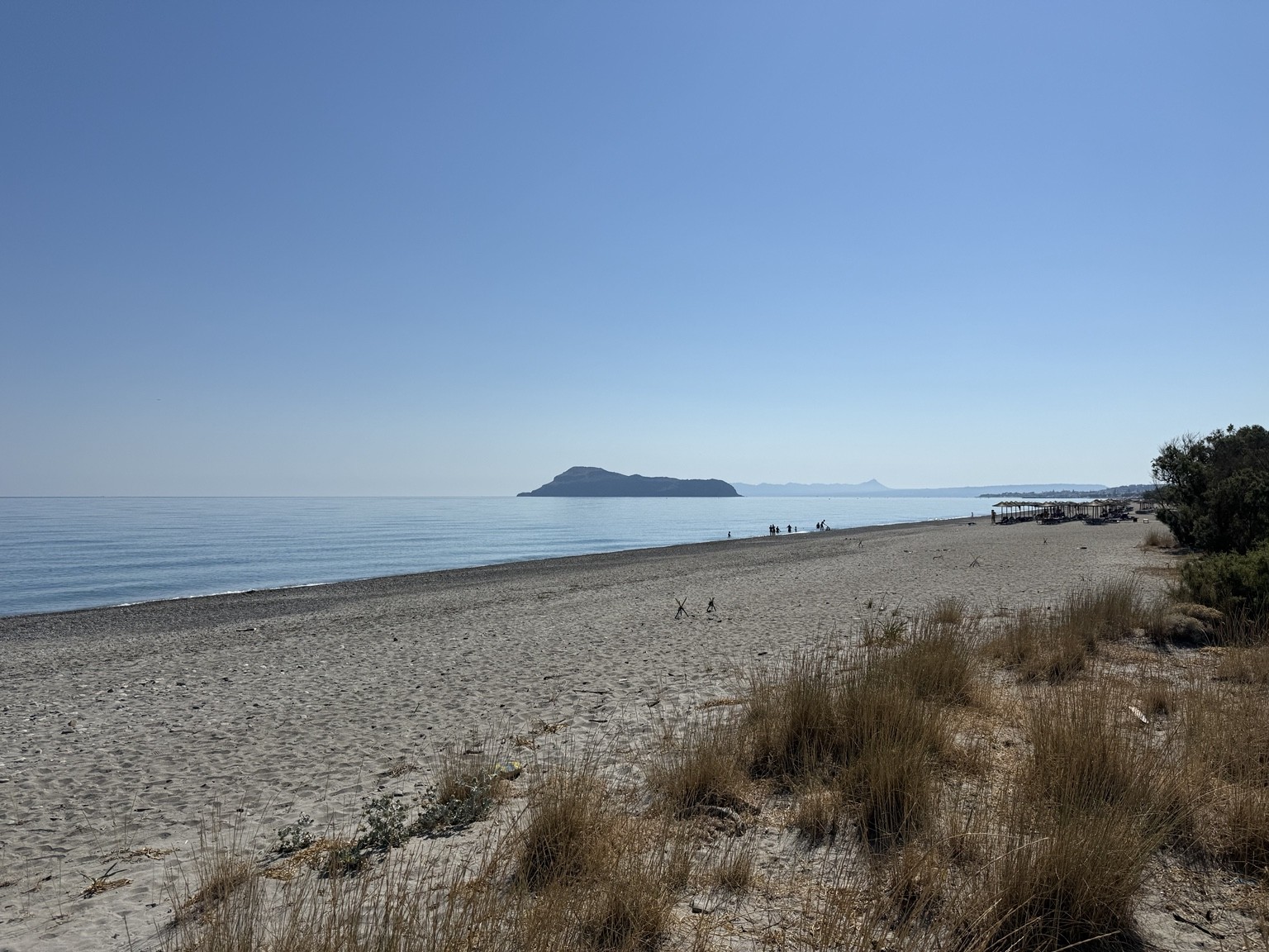 Gerani beach — actual photograph of the sandy beach beside the project